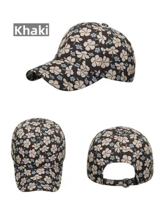 Detail view of khaki floral baseball cap with metal adjustable buckle and petal pattern