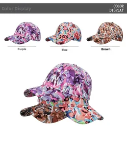 Detailed view of floral baseball caps in purple, blue and brown with gold outlines