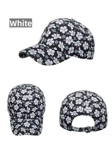 Detail view of floral baseball cap with metal buckle and adjustable strap
