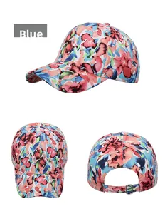 Detail view of floral baseball cap showing top panel and metal adjustment buckle