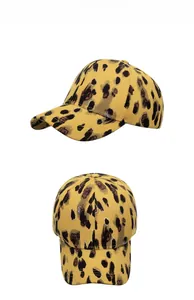 Dual view of a yellow canvas baseball cap featuring retro leopard print with gold outlines