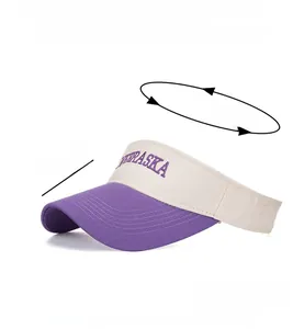 Detail view of contrast color sun visor hat with purple Nebraska letter embroidery