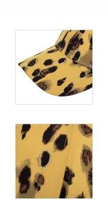 Close-up of leopard print baseball cap with gold glitter spots and detailed stitching