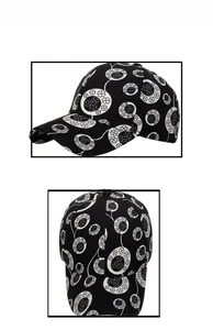 Detail view of cotton baseball cap featuring black and white clover circle patterns