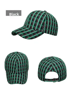 Detail of plaid baseball cap showing metal adjustment buckle and tweed fabric texture