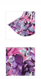 Detailed macro shot of floral print fabric with gold glitter outlines and pink stitching