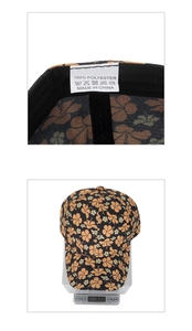 Detail of flower baseball cap showing 100% polyester label and weight of 69.4g