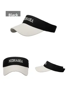 Detailed views of a black and white visor with Nebraska embroidery and sun protection