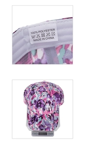 Detail view of pink floral baseball cap with 100% polyester label and weight measurement
