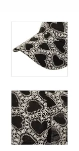 Close-up of intricate heart embroidery and textured fabric on this stylish baseball cap