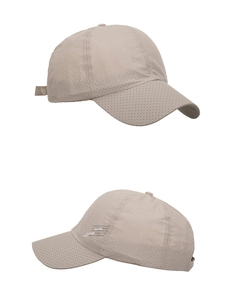 Detail of breathable laser-cut holes and LEADING symbol on khaki baseball cap