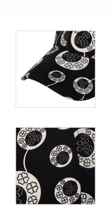 Close-up of black and white four-leaf clover print on twill cotton baseball cap