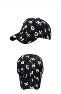 Detail view of black baseball cap with white all-over letter print and canvas texture