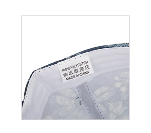 Detail view of the floral baseball cap interior showing the 100% polyester wash label and lining