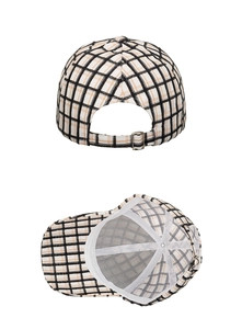 Detail view of plaid baseball cap showing metal adjustment buckle and inner lining