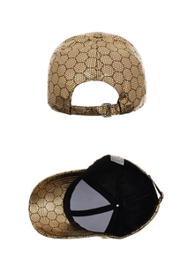 Detail view of metallic gold baseball cap featuring black honeycomb mesh and metal buckle
