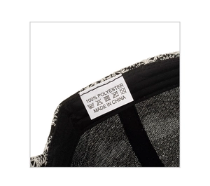 Close-up of heart embroidery baseball cap interior with 100% polyester care label