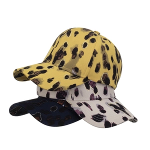 Three-piece leopard print baseball caps with golden glitter spots in yellow, grey, and navy