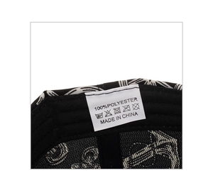 Detailed close-up showing the 100% polyester fabric label and stitching of the baseball cap