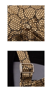 Detail of baseball cap showing golden hexagonal honeycomb texture and silver metal buckle