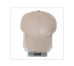 Detailed close-up showing the lightweight mesh fabric and side leading letters of the cap