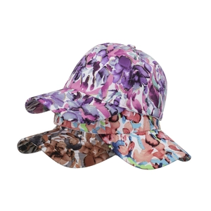 Three colorful floral baseball caps with abstract watercolor patterns for women's sun protection