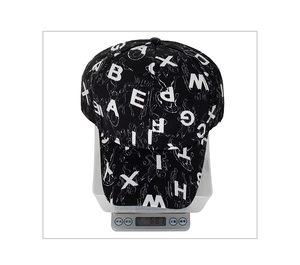 Detail showing the lightweight 68.1g build of the black letter-print baseball cap