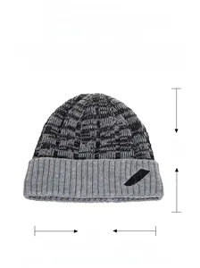Detail of 100% acrylic knit beanie featuring black and grey wave texture and logo