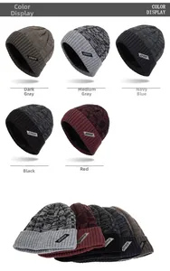 Detail view of colorful knitted beanie hats with fleece lining and Xhboy leather logo patch