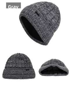 Detail of grey winter knit beanie with thick fleece lining and warm cable knit texture
