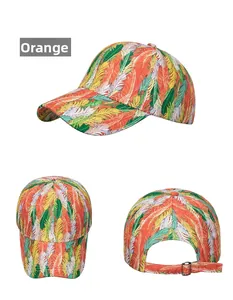 Detailed view of an orange baseball cap with colorful feather prints and metal buckle strap
