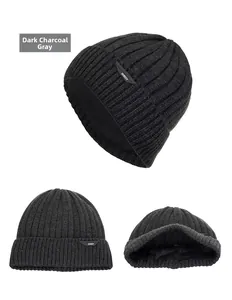 Detailed view of dark grey ribbed knit beanie with thick fleece lining for winter warmth