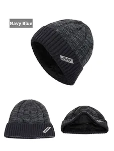 Detail of navy blue knit beanie with thick fleece lining and Xhboy brand label