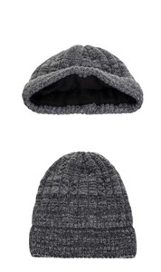 Detail of gray cable-knit beanie featuring thick black fleece lining for winter warmth