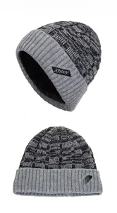 Detail of grey striped knit beanie featuring thick fleece lining and Xhboy leather label