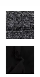 Detailed macro view of the thick cable knit pattern and warm fleece lining on the beanie