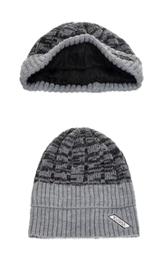 Detailed view of the thick knit texture and warm black fleece lining on this winter beanie