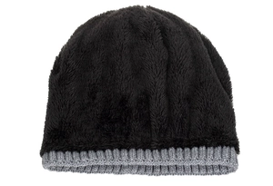 Detailed close-up of thick black plush lining and grey ribbed knit edge on winter beanie