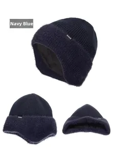 Detail view of navy blue knitted winter hat with thick plush lining and earflaps