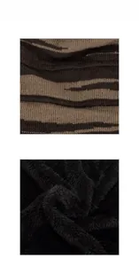 Detailed macro view of striped knit fabric and thick black fleece lining for warmth