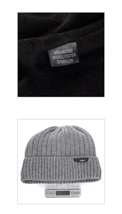 Detail of grey knitted beanie with XHBOY label and fabric composition tag