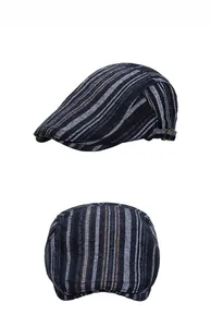 Detail view of navy striped flat cap with adjustable bronze metal side buckle closure