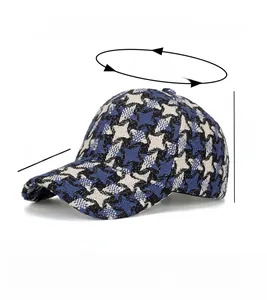 Detail view of houndstooth baseball cap showing size 56-60cm and polyester material
