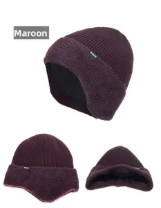 Detail view of wine red knit hat with plush earflaps and thick fleece lining for winter