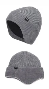 Detail view of the thick fleece lining and vertical knit texture of the winter hat