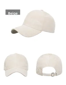 Detail view of beige suede baseball cap with adjustable metal buckle and six-panel crown