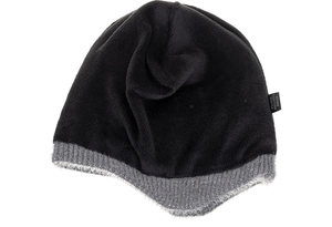 Close-up of thick thermal faux fur lining and fabric content label on knitted earflap hat