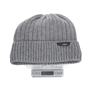 Winter rib knit beanie in grey with leather patch showing 120g weight on scale