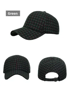 Detail view of green plaid baseball cap with adjustable metal buckle and thick fabric