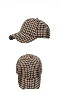 Detail view of the vintage plaid baseball cap showing fabric texture and crown structure
